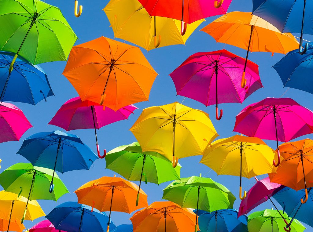Header image of multi-coloured flying umbrellas